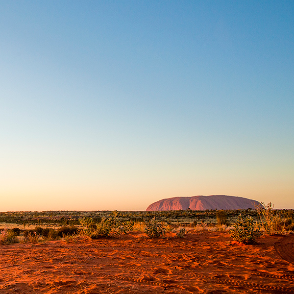 Scenic shot of Uluru at sunrise. Credit: Tourism NT and Paddy Pallin